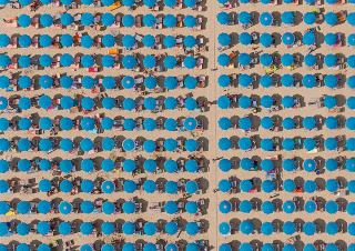 Illustration for article titled Aerial Shots of Beach Show Man Wringing Order From Nature